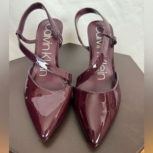 Calvin Klein high heel shoes. Burgundy, shinny faux leather. Size 7.